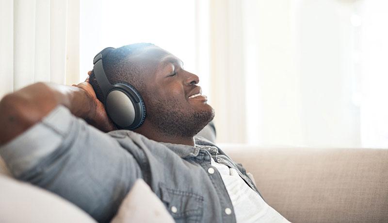 stress-free smiling man wearing headphones